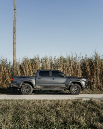 graphite toyota tacoma parked on a country road