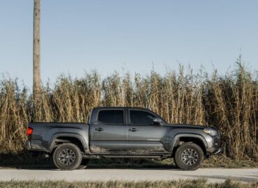 graphite toyota tacoma parked on a country road