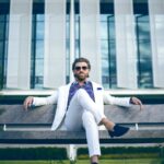 man wearing white suit jacket and white pants