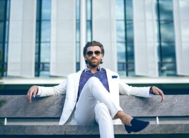 man wearing white suit jacket and white pants