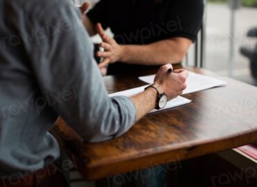 Two people discussing business table