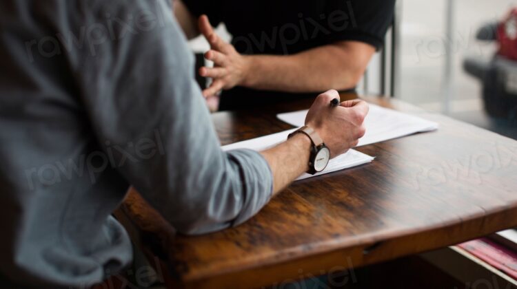 Two people discussing business table